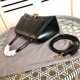 Styled lifestyle shot of structured classic women's handbag – women's everyday handbag