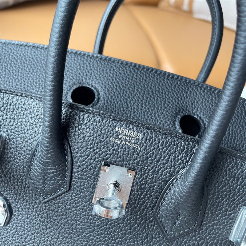  Classic top-handle bag carried on shoulder 10
