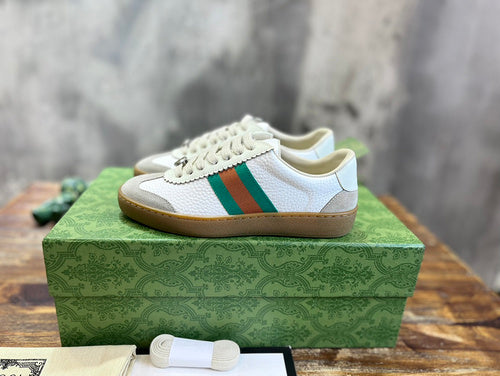 Gucci Designer sneakers in bold contrast signature lace-up style front view