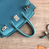 Side view of sculpted structured handbag
