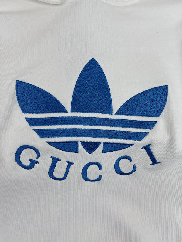 Close-up detail shot of Gucci luxury clothing with logo-detail design