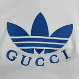 Close-up detail shot of Gucci luxury clothing with logo-detail design