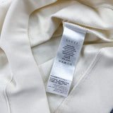 Side profile of Gucci luxury clothing with signature branding