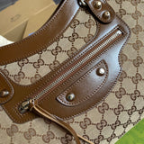 Side profile of polished refined women's handbag – women's luxury handbag