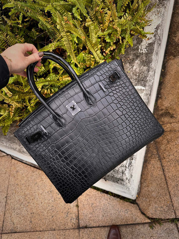 Side view of understated structured handbag