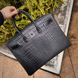 Side view of understated structured handbag