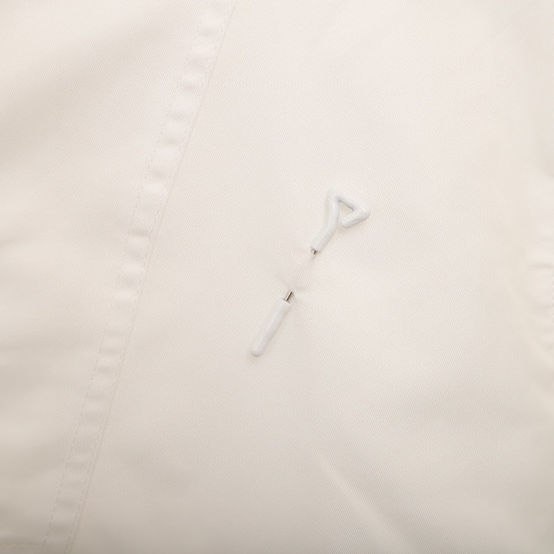 Side profile of Louis Vuitton luxury clothing with logo-detail design