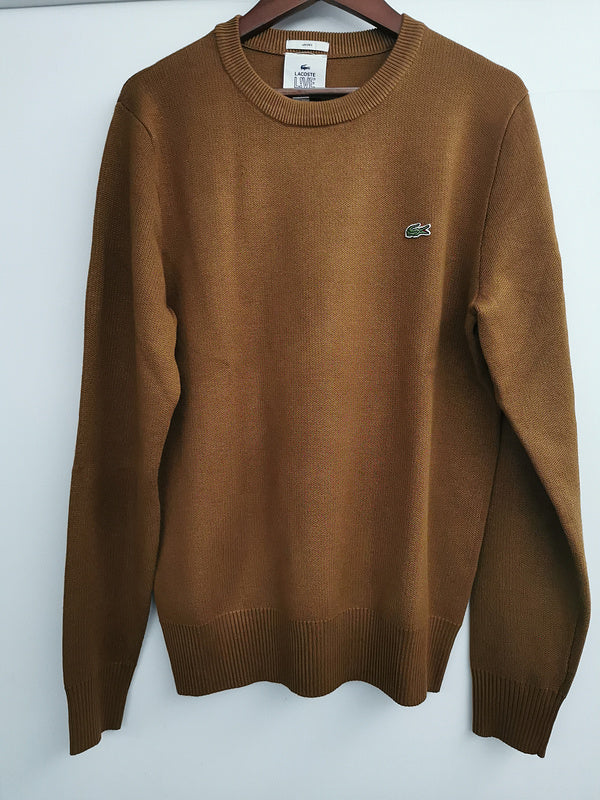 Close-up detail shot of Lacoste luxury clothing with logo-detail design