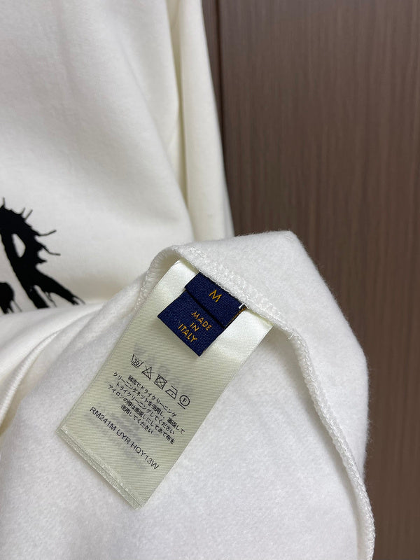 Close-up detail shot of Louis Vuitton luxury clothing with signature branding