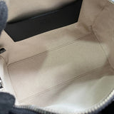 Side profile of polished structured women's handbag – women's statement bag