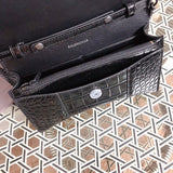 Side profile of polished statement women's handbag – women's everyday handbag