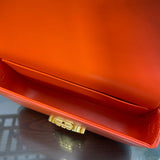 Top view of elevated polished women's handbag – women's statement bag