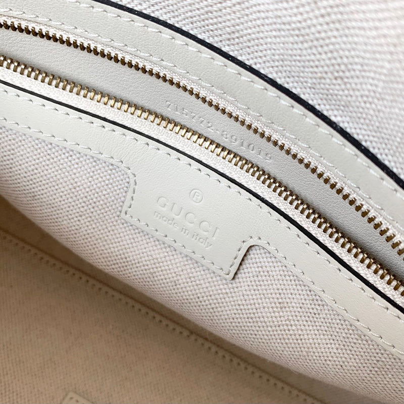 Handle and strap detail of statement polished women's handbag – women's everyday handbag