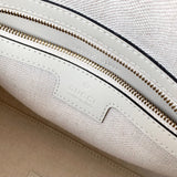 Handle and strap detail of statement polished women's handbag – women's everyday handbag