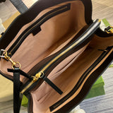 Side profile of structured everyday-luxe women's handbag – women's designer-style accessory