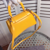 Back view of signature statement women's handbag – women's statement bag
