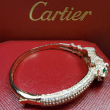 Side view of Cartier unisex jewelry piece