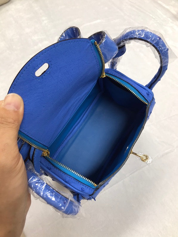 Side view of curated structured handbag