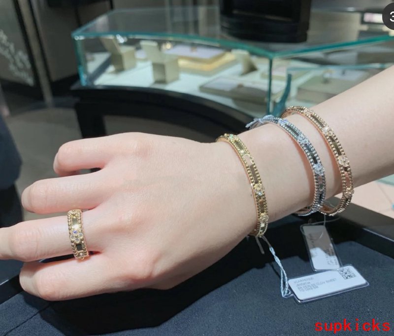 Lifestyle view of Van Cleef & Arpels unisex jewelry piece
