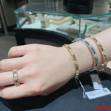 Lifestyle view of Van Cleef & Arpels unisex jewelry piece