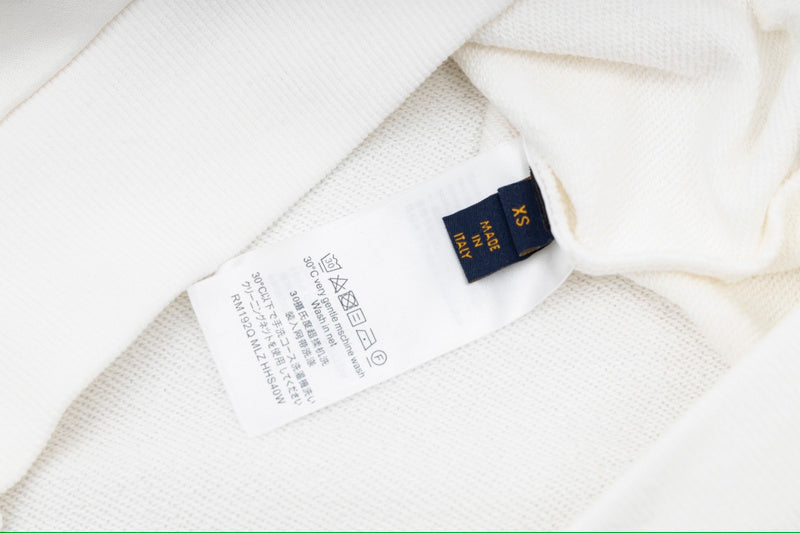 Close-up detail shot of Louis Vuitton luxury clothing with everyday silhouette
