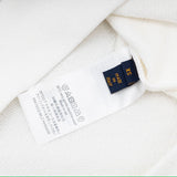 Close-up detail shot of Louis Vuitton luxury clothing with everyday silhouette