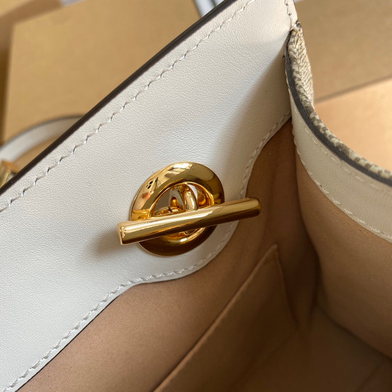 Side profile of statement refined women's handbag – women's designer-style accessory