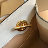 Side profile of statement refined women's handbag – women's designer-style accessory