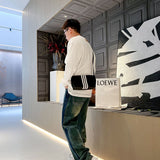 Close-up detail shot of Louis Vuitton luxury clothing with relaxed-fit cut