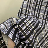 Close-up detail shot of Louis Vuitton luxury clothing with streetwear-inspired cut