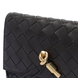 Close-up of Bottega Veneta clutches hardware and fine stitching