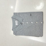 Side profile of Lacoste luxury clothing with tailored silhouette