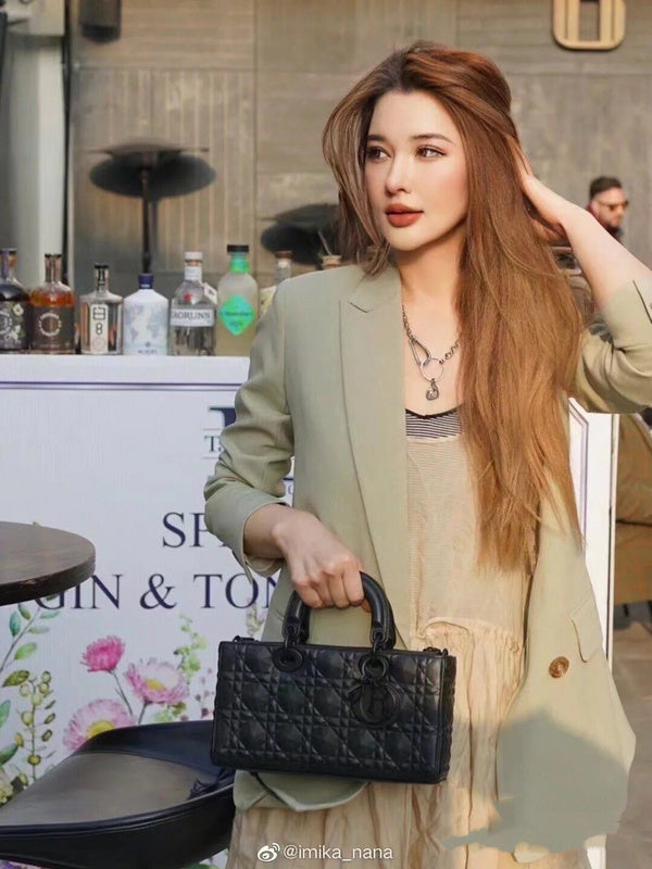 Front view of elevated modern women's handbag – women's luxury accessory