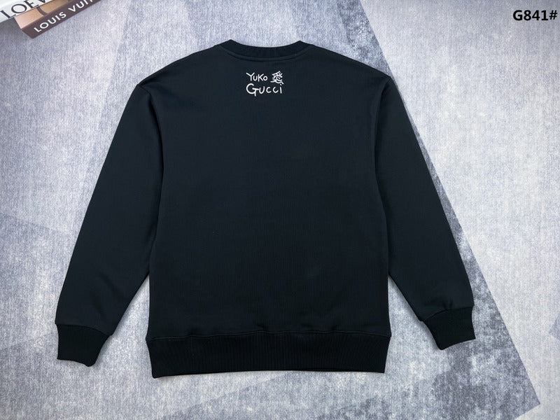 Side profile of Gucci luxury clothing with signature branding