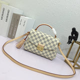 Side profile of elevated modern women's handbag – women's luxury accessory