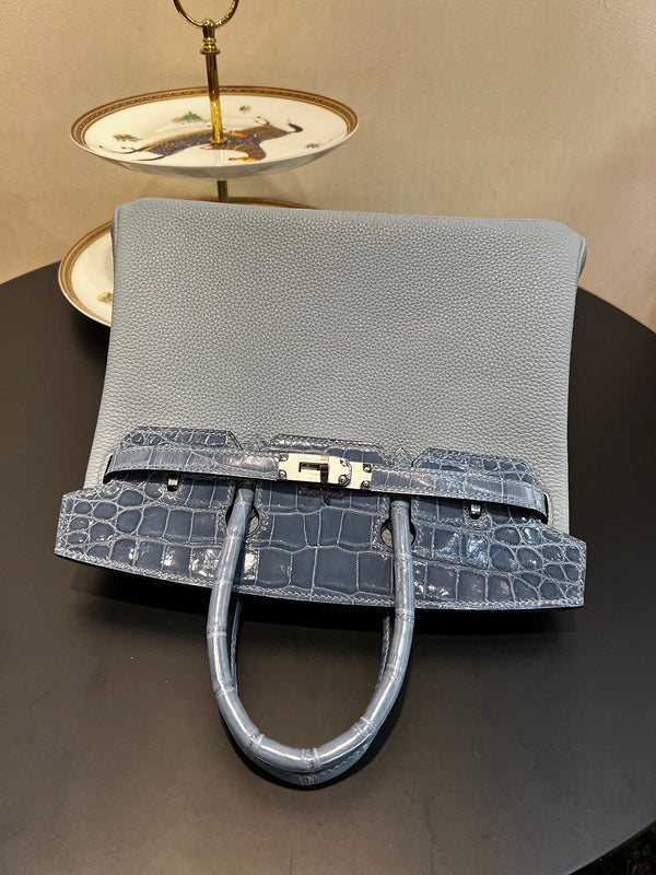 Side view of fluid structured handbag
