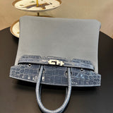 Side view of fluid structured handbag
