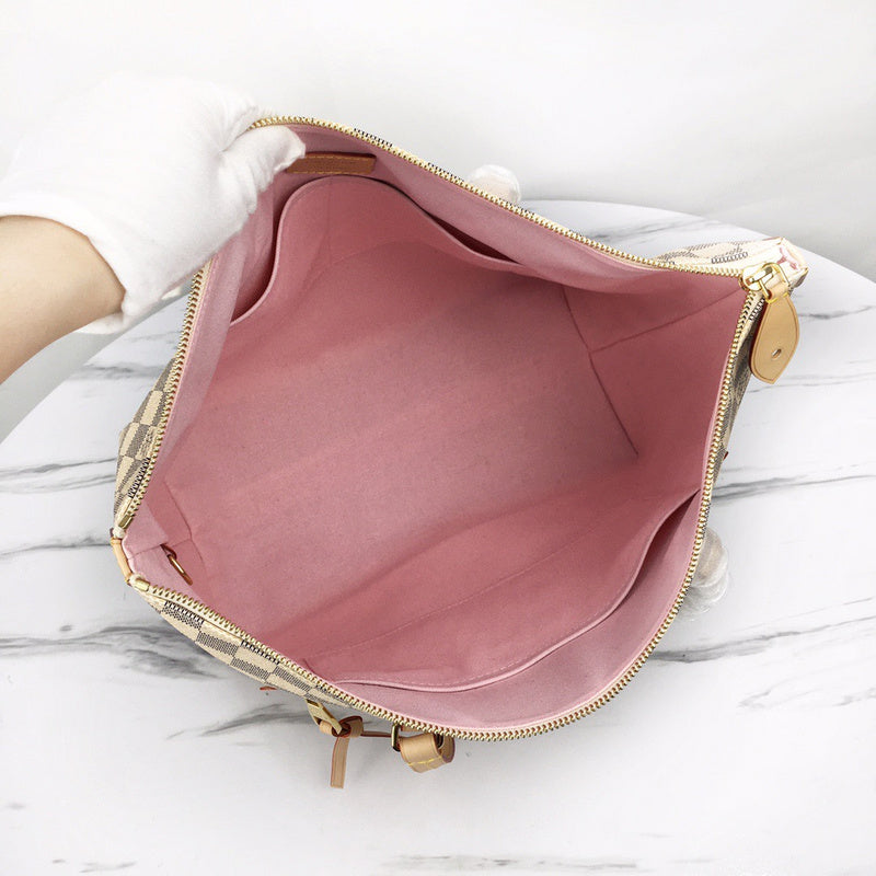 Back view of signature polished women's handbag – women's everyday handbag