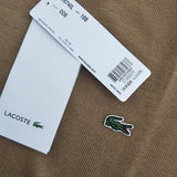 Close-up detail shot of Lacoste luxury clothing with monogram-inspired silhouette