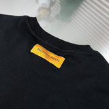 Back view of Louis Vuitton luxury clothing with signature branding