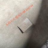 Side profile of signature classic women's handbag – women's statement bag