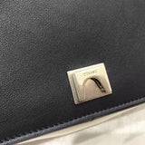 Side profile of statement refined women's handbag – women's luxury accessory