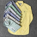 Front view of Lacoste luxury clothing with monogram-inspired silhouette