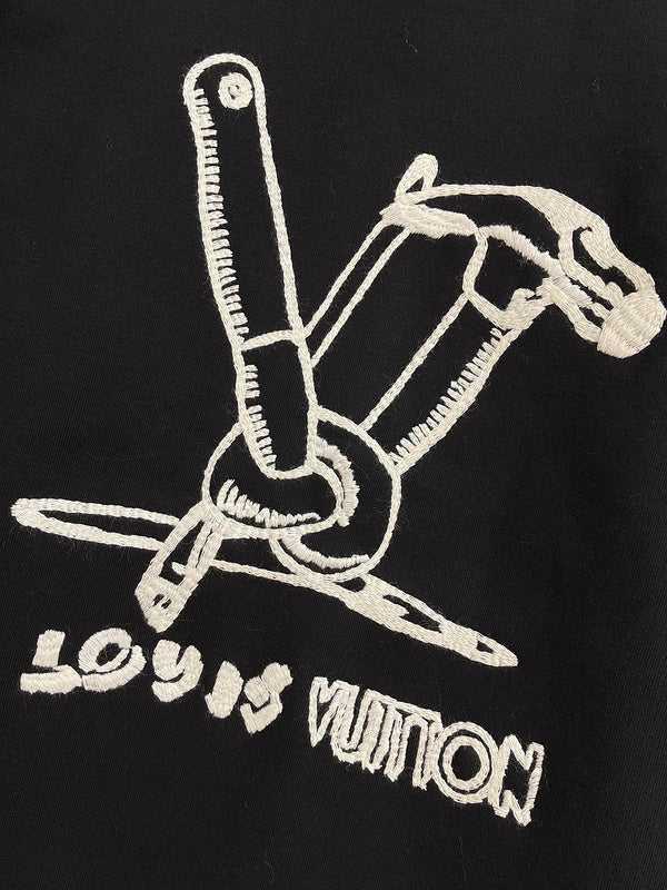 Flat lay presentation of Louis Vuitton luxury clothing with logo-detail design