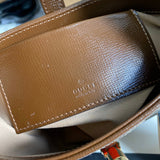 Side profile of chic polished women's handbag – women's everyday handbag