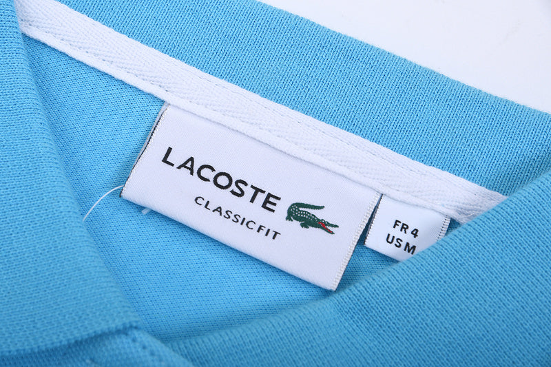 Close-up detail shot of Lacoste luxury clothing with signature branding
