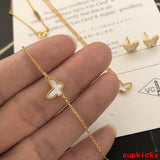 Lifestyle view of Van Cleef & Arpels unisex jewelry piece