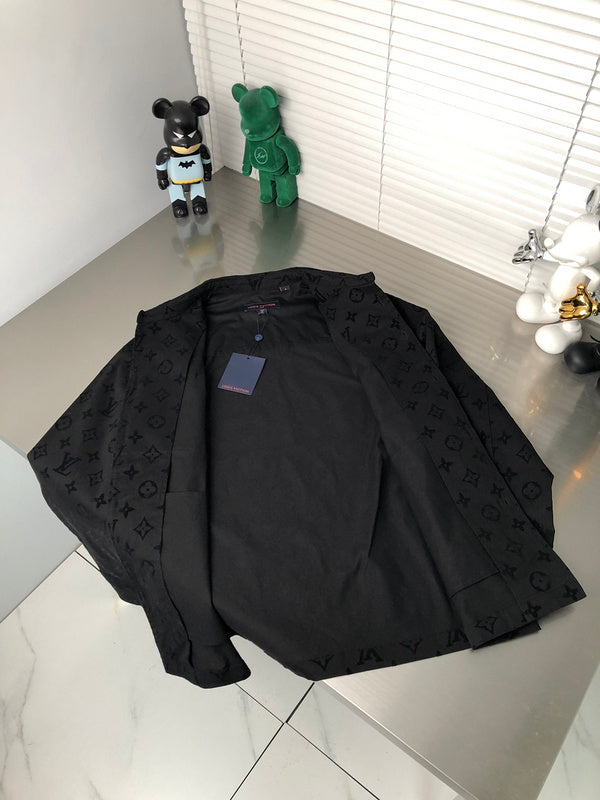 Flat lay presentation of Louis Vuitton luxury clothing with signature branding