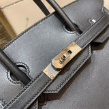Side view of refined structured handbag