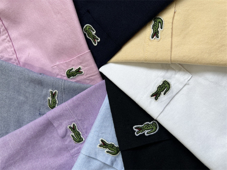 Flat lay presentation of Lacoste luxury clothing with logo-detail design